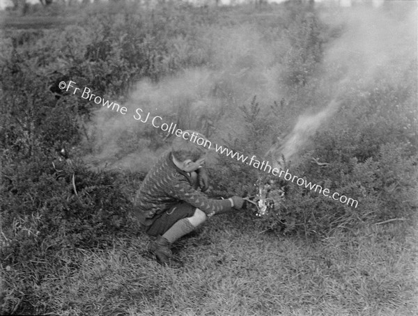 BOY LIGHTING BONFIRE